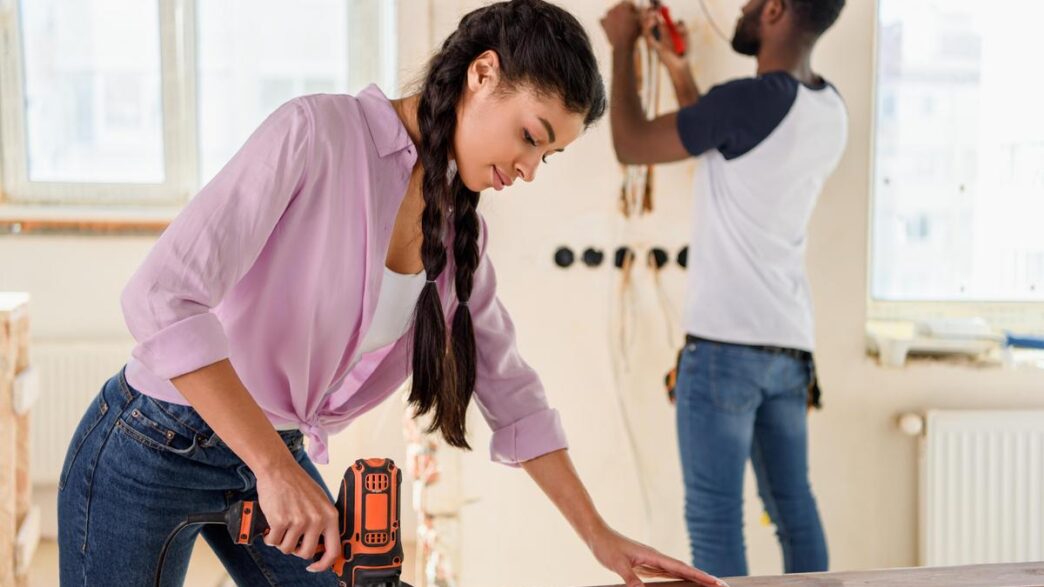 Meticulously organized home renovation workspace with professional power tools and natural lighting.